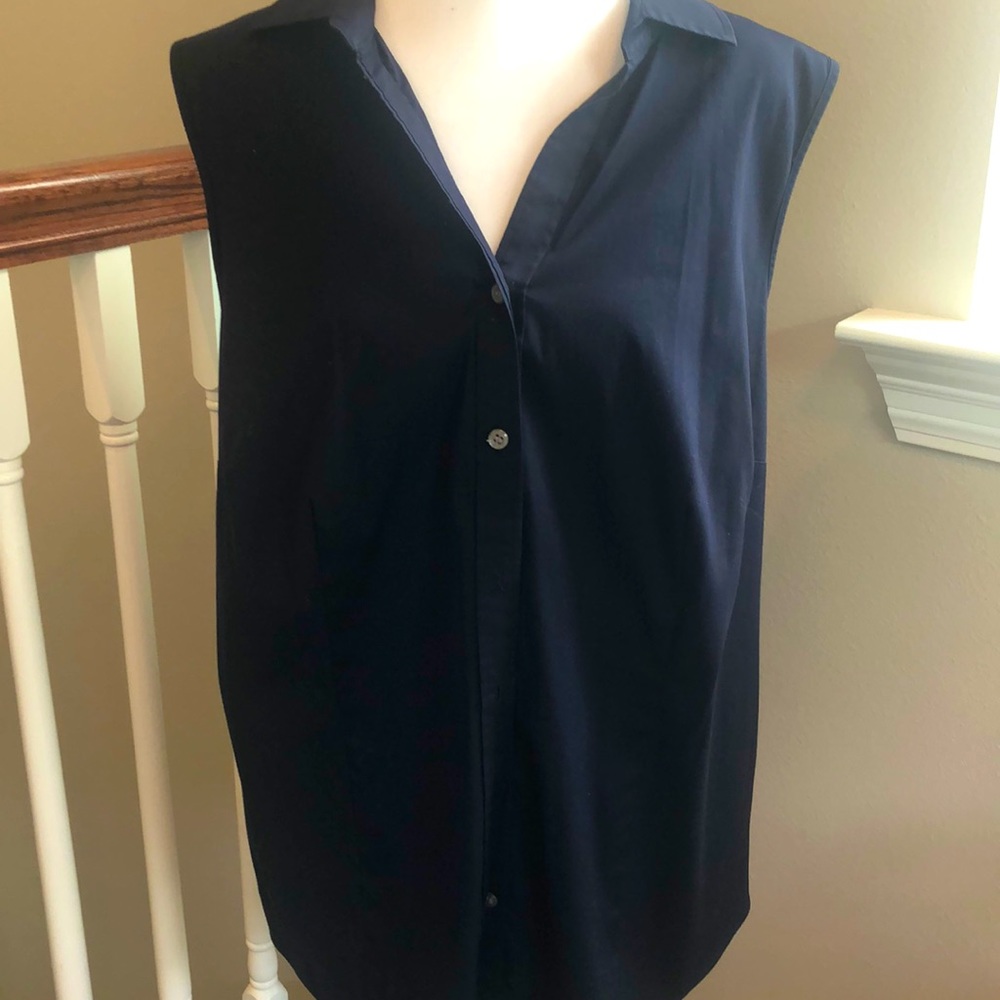 Navy sleeveless cotton button down blouse.